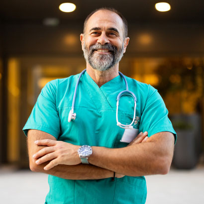 mature-surgeon-outside-hospital